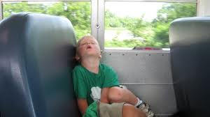 A child sleeping in a long bus ride